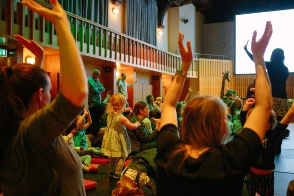 An audience of children and families at an Opera North Howard Assembly Room family event.