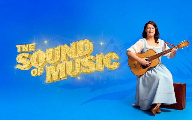 A woman sat playing guitar in front of a stylised blue backdrop of mountain peaks, beside the words "The Sound of Music".