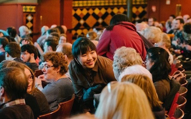 Audience members in their seats at Leeds Grand Theatre