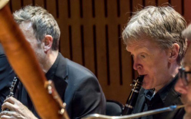 A close-up of an orchestral wind section.