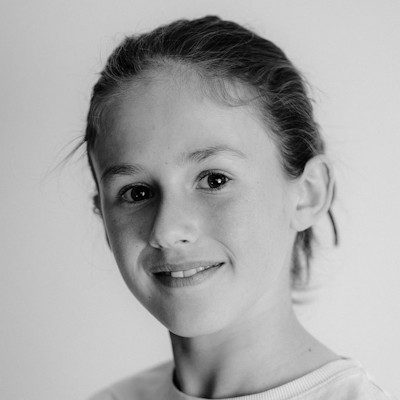 A black and white close-up of a girl with dark hair.