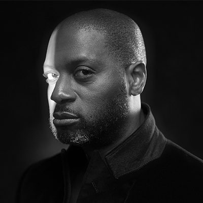 A black man with short short hair and a beard